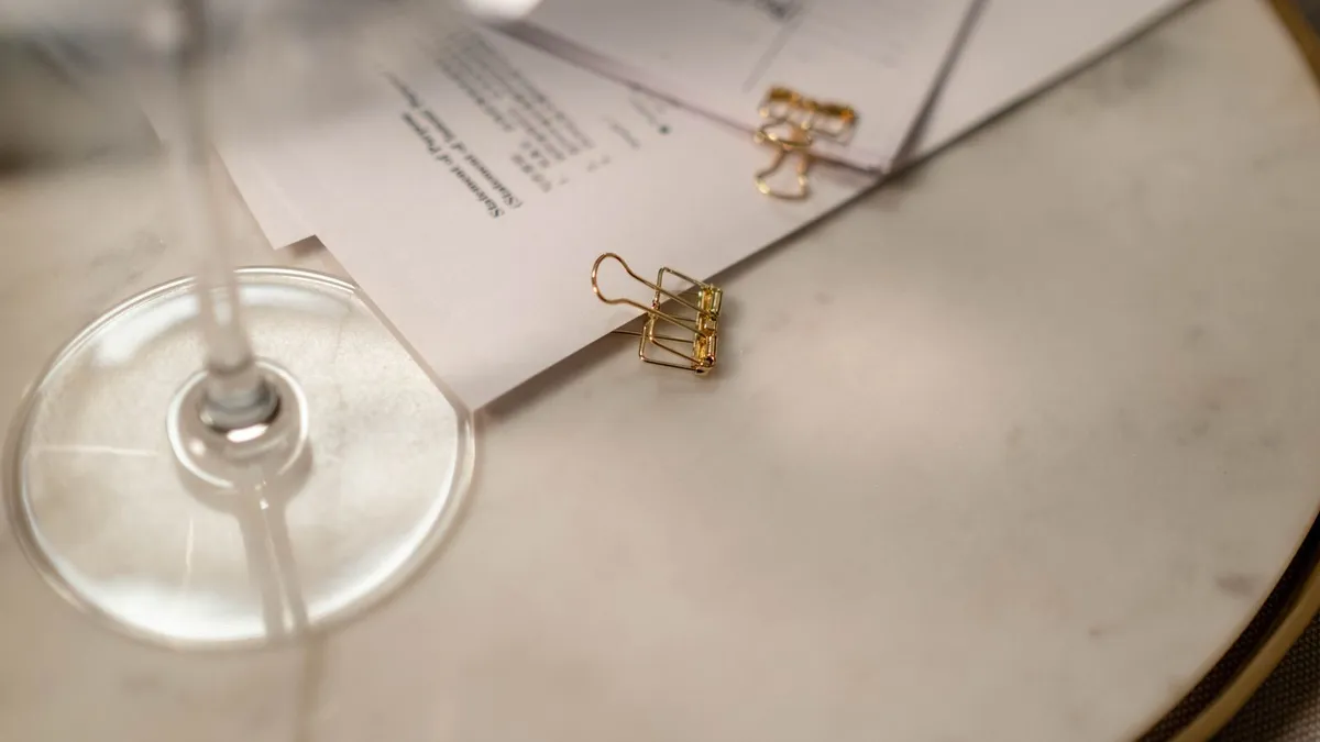 Calm home desk with disability debt relief documents and a cup of tea
