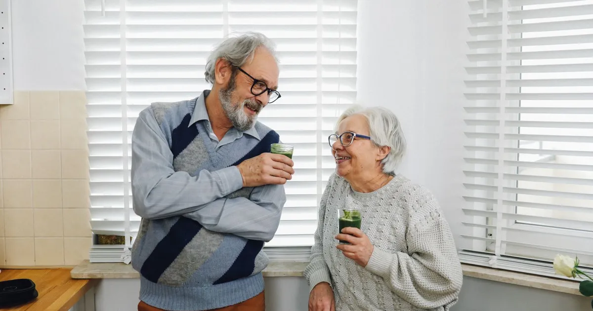 Senior couple at a kitchen table comparing pension debt relief options in Canada